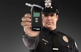 DUI attorney in philadelphia - cop holding a breathalyzer